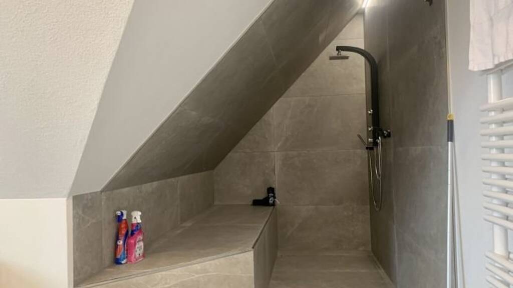 Modern 2.5-Room Loft with Balcony, E-Mobility Parking & Scenic Views