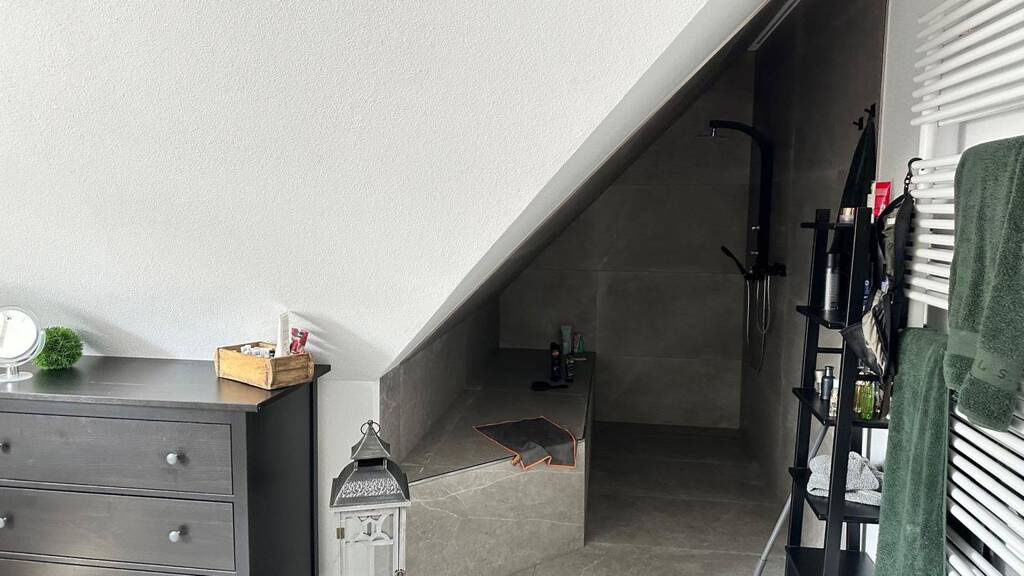 Modern 2.5-Room Loft with Balcony, E-Mobility Parking & Scenic Views