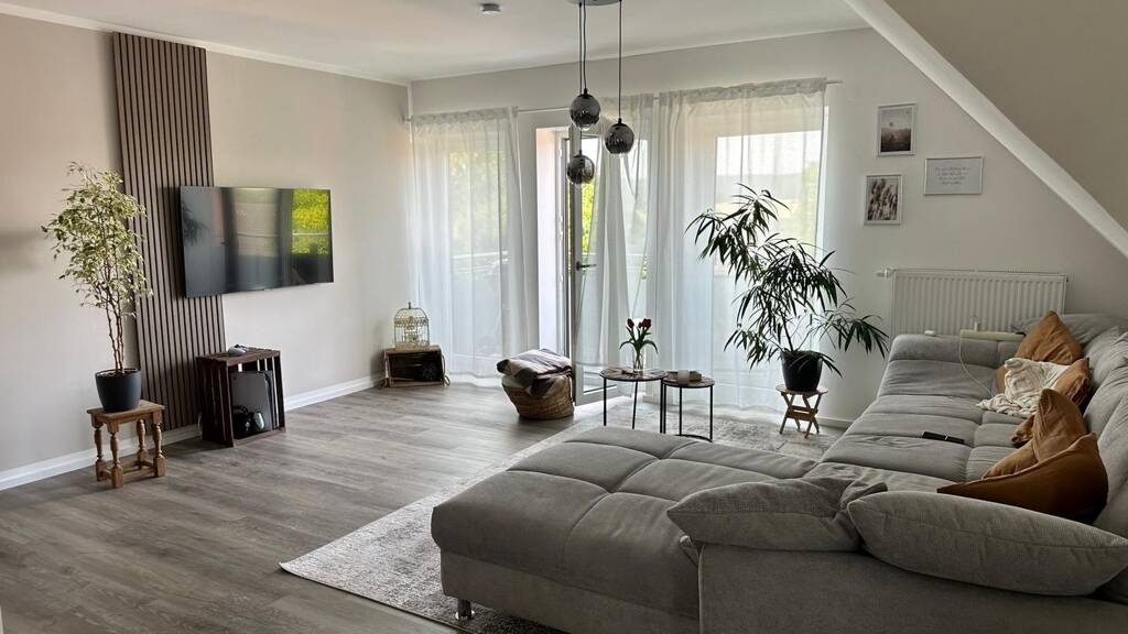 Modern 2.5-Room Loft with Balcony, E-Mobility Parking & Scenic Views