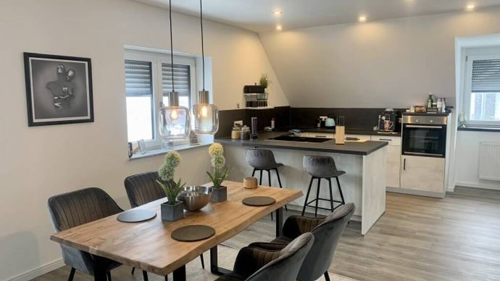 Modern 2.5-Room Loft with Balcony, E-Mobility Parking & Scenic Views