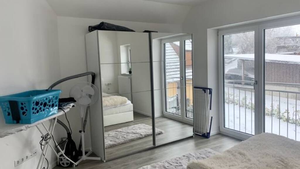 Modern 2.5-Room Loft with Balcony, E-Mobility Parking & Scenic Views