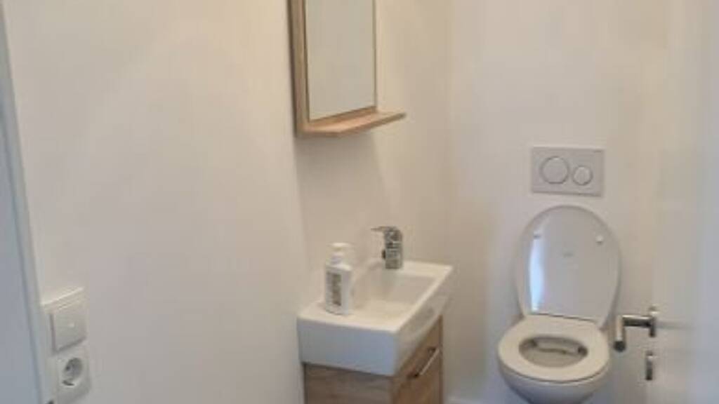 Modern 2.5-Room Loft with Balcony, E-Mobility Parking & Scenic Views